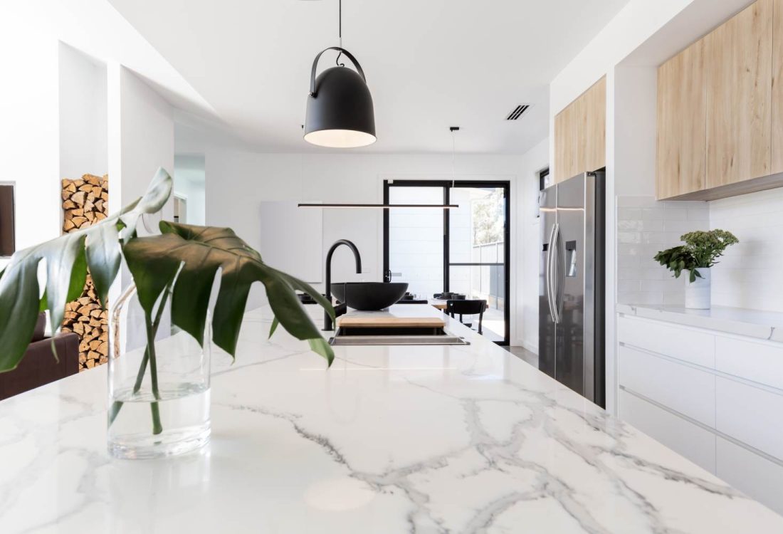 Kitchen,Marble,Bench,Close,Up,With,Black,Hanging,Pendant,And