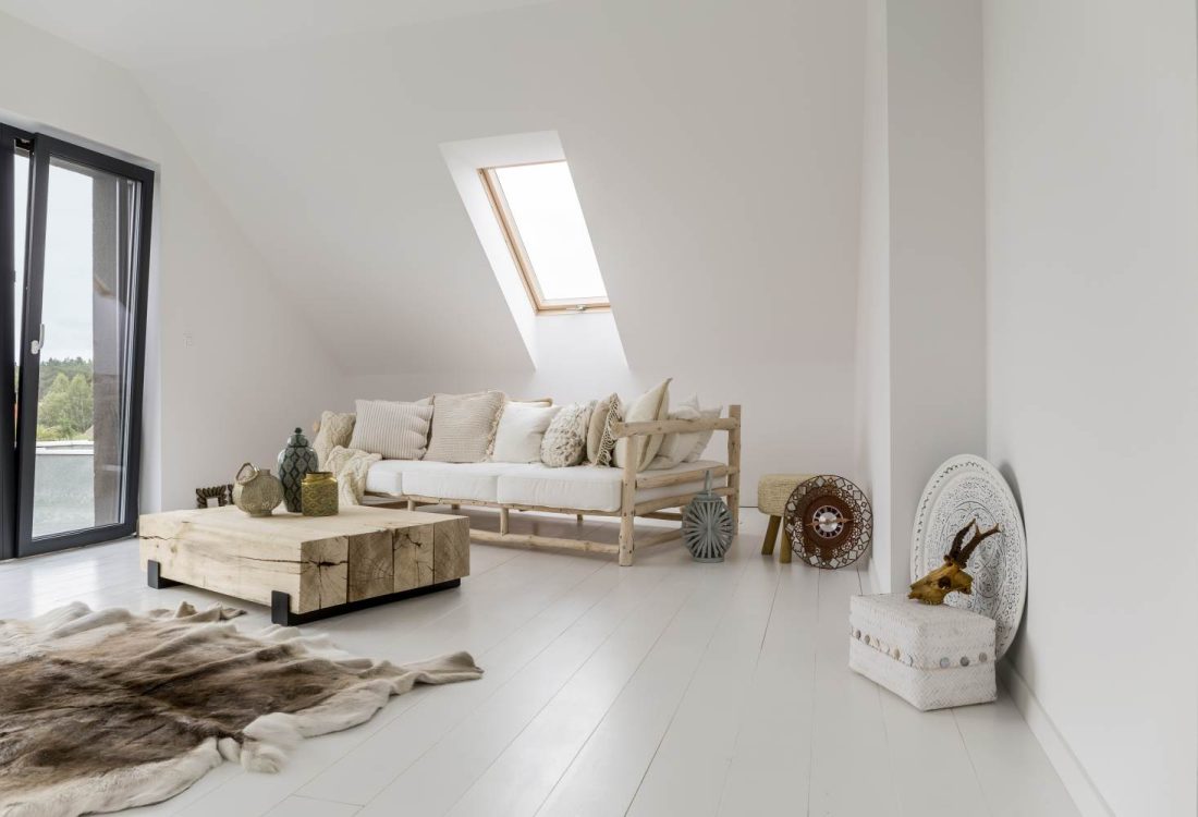 White,Spacious,Room,With,Stylish,Wooden,Furniture,And,Roof,Window